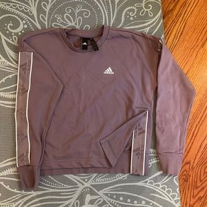 Womens adidas shirt with adidas patches on arms and shirt